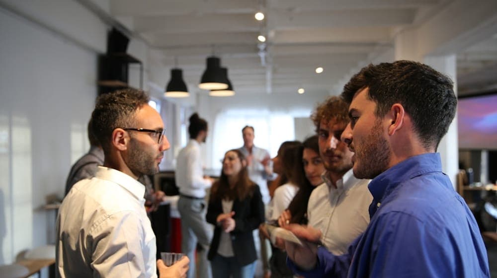 a group of people standing in a room